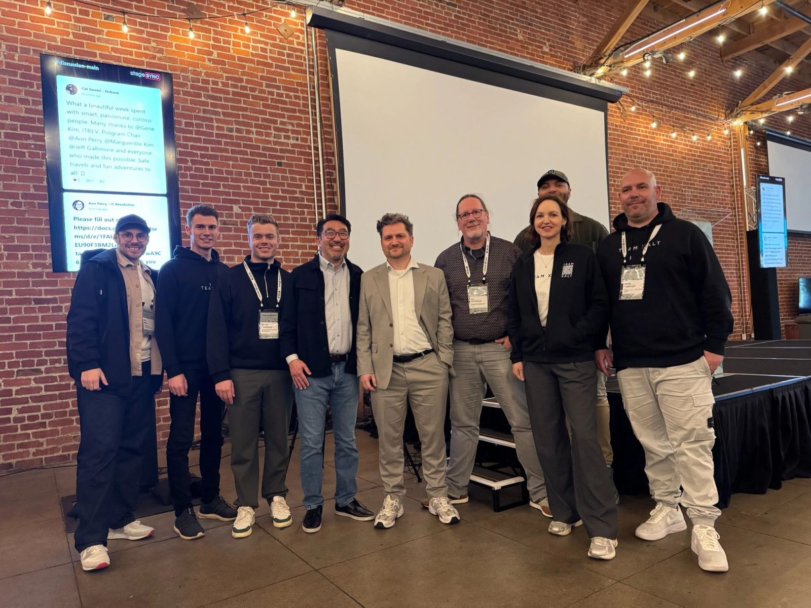 Group of summit attendees in front of a stage in Charlotte